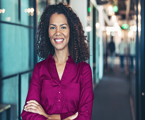 Man & Woman seated on two purple couches 